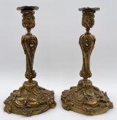 A pair of 19th century French brass candlesticks in the Rococo style. H.27cm (each)