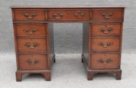 A 19th century mahogany three section pedestal desk with inset leather top. H.74 W.106 D.59cm