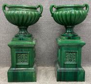 A pair of 19th century style stoneware iridescent green lustre glazed jardinieres on stands, the