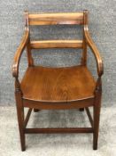 A 19th century mahogany and elm seated armchair. H.84cm.