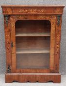 A 19th century figured walnut pier cabinet dwarf bookcase with ormolu mounts and foliate