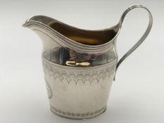 A George III silver cream jug, London 1801. H.12cm. 146g.