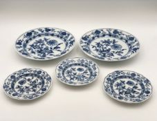 A collection of five hand painted Meissen blue and white plates with marks in underglaze blue to the