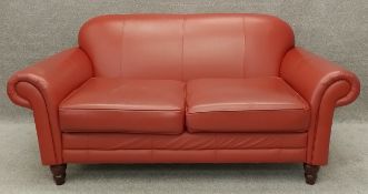 A 19th century style two seater sofa upholstered in faux leather. H.92 W.186 D.100cm