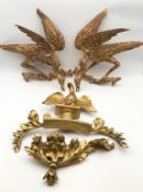 A collection of Georgian carved giltwood mirror crestings. H.40 W.43cm (largest).