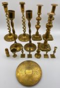 A collection of 19th century brass candlesticks, to include various pairs along with an engraved
