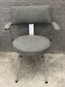 A mid century industrial style armchair reupholstered in piped calico on chrome supports. H.77cm.