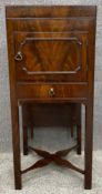 A Georgian flame mahogany washstand with rising mirror with its original mercury plate and a