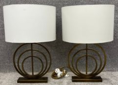A pair of contemporary John Lewis Ainsley antique brass lamps with shades. H.69cm (each)