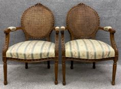 A pair of Louis XVI carved beech framed bergere armchairs with rattan backs and needlework