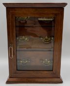 An Edwardian rosewood collector's cabinet with satinwood and bone marquetry, string inlay and a