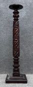 A 19th century carved and turned mahogany jardiniere stand. H.111cm