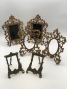 A collection of three pairs of brass easel picture frames. H.31 W.23cm (largest).