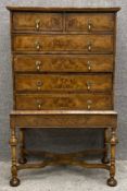 A William and Mary burr walnut and crossbanded chest on stand of small size with two short above