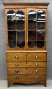 A Georgian mahogany and satinwood inlaid two section library bookcase with upper glazed section