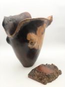 A large contemporary hardwood vessel of flared naturalistic form along with a polished block of burr