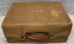 An early 20th century Hill & Millard crocodile skin travelling vanity case with a fitted interior,