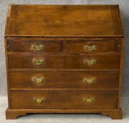 A Georgian oak bureau with a fitted interior. H.103 W.106 D.55cm