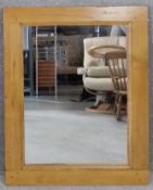 A contemporary teak framed mirror. H.100 W.80cm