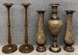A pair of Eastern painted and engraved brass vases with a matching urn, along with two turned