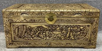 A vintage Chinese carved camphorwood coffer. H.40 W.89 D.44cm