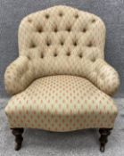 A Victorian Cornelius V. Smith buttonback nursing chair on turned oak legs with C.V.S. maker's stamp