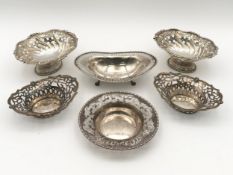 A pair of 19th century English hallmarked silver bon bon dishes, with two other similar dishes,