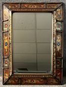 A carved and hand decorated cushion frame mirror with bevelled plate. H.79 W.59cm