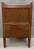 A Georgian mahogany and ebony inlaid night cabinet fitted with tambour front door. 82 x 51 x 45cm.