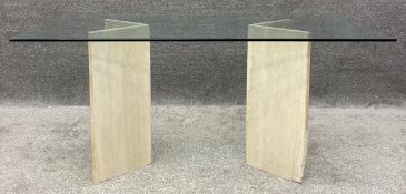A 1970's vintage dining table with bevelled plate glass top on Travertine marble pedestal