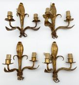 A set of four gilt metal twin branch Florentine wall sconces in a naturalistic foliate design. H.25