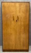 A mid century Art Deco style birdseye maple wardrobe with fitted interior. H.155 W.84 D.49cm.