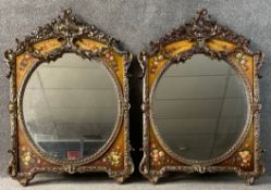 A pair of continental style wall mirrors hand decorated with garlands of flowers. H.112 W.83cm (
