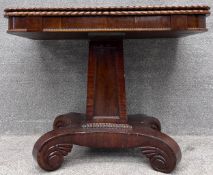 A William IV mahogany swivel top action tea table with gadroon edged top on an acanthus carved
