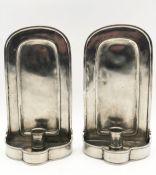A pair of 19th century pewter wall hanging candle sconces marked 95 to the backs. H.26 W.14cm.
