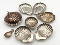 A collection of English hallmarked silver and silver plated scallop dishes. Silver weight 159g as