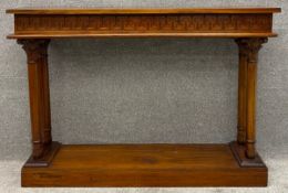 A contemporary teak console table with classical motifs. H.90 W.129 D.33cm