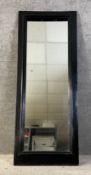 A full length painted mirror with a mitred and moulded wooden surround. H.197 W.76cm