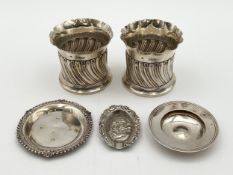 A pair of William Comyns & Sons Ltd. silver fluted vases along with two hallmarked silver dishes,