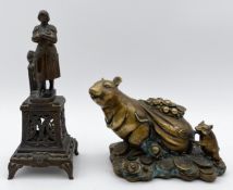Two cast metal figures; one a bronzed brass Oriental zodiac rat carrying a sack of coins, and the