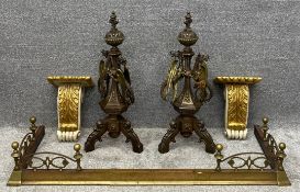 A 19th century copper and brass fire kerb along with a pair of bronzed cast iron and brass fire dogs