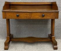 A mid 19th century oak writing table fitted with frieze drawers. H.89 W.98 D.52cm.