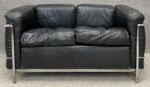 After a design by Le Corbusier for Cassina an LC2 sofa in black upholstery, stamped and with Cassina