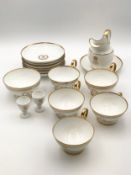A 19th century Sevres breakfast service for six, gilt decorated with crest and marks to base. H.15cm