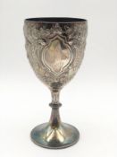 A silver goblet with embossed decoration marked Sheffield 1902. H.21cm. Weight 157g.
