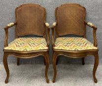 A pair of Louis XV style beech framed armchairs. H.100cm.