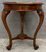 A late 19th century mahogany occasional table on well carved cabriole supports united by an