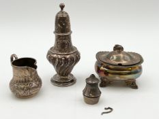 A miscellaneous collection of 925 silver to include, a sugar pot with a blue glass lining on splayed