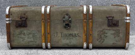 A vintage metal and beech bound steamer trunk. H.32 W.91 D.52cm