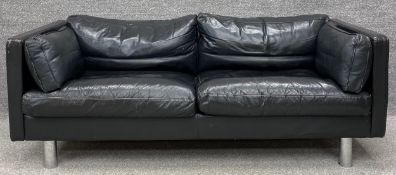 A mid century Danish Erik Jorgensen two seater sofa in black leather upholstery. H.64 W.178 D.87cm.